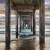 “This composition is a blend of nature and architecture. Shooting beneath the structure to get a unique perspective, I waited for days for a thick mist to lift and reveal the backlighting and color I needed to frame the pier’s converging lines. I was f