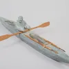 a sculpture os a kayaker