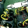 A robotic arm puts samples in containers