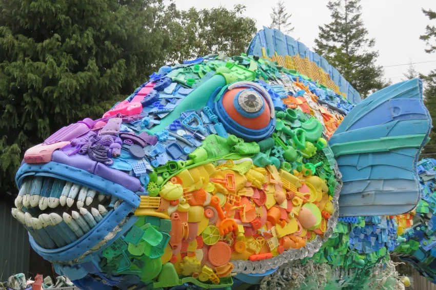 The colorful parrotfish sculpture is made entirely of ocean plastic trash.