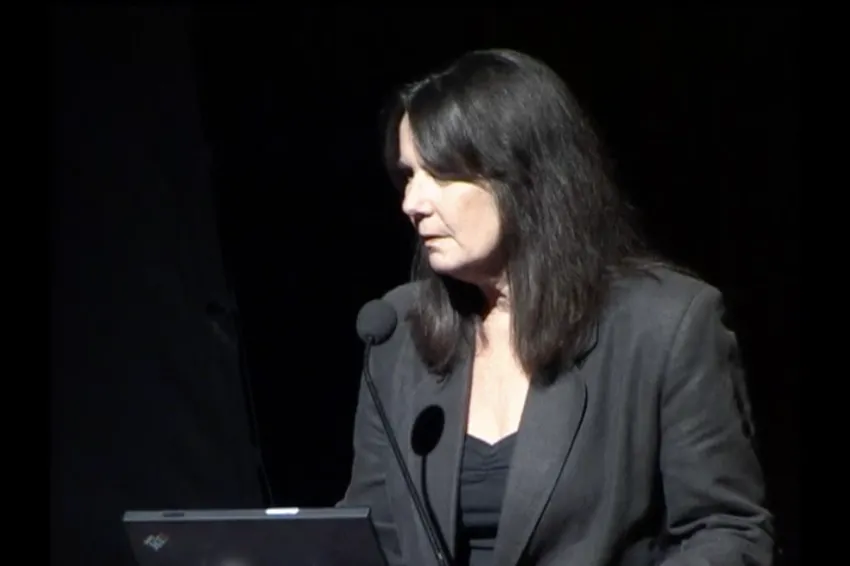 Dr. Rabalais speaking at a podium