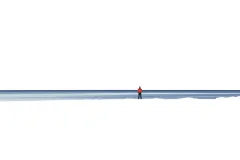 A white Antarctic landscape with John Weller standing away from the camera in the distance. 