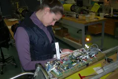A student prepares the glider's internal electronics.
