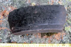 a seven inch fragment of an Inuit soapstone pot recovered at Hare Harbor in Quebec, Canada 