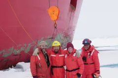 Dr. Kathy Crane and colleagues stand on solid sea ice in the Canadian Arctic.