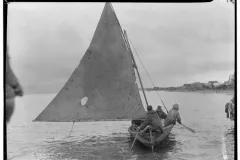 a skin boat with a sail