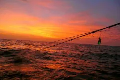 Sunset over a fishing net. 