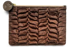 A clutch bag made from fish skin that is folded into ruffle patterns.