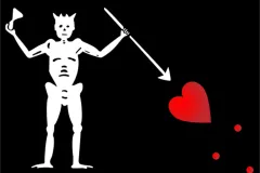 Blackbeard’s flag showed a skeleton piercing a heart and toasting the devil.