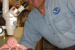 NOAA Marine Biologist Robert Brock with microscope