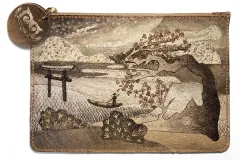 A clutch bag made from fish skin with a detailed design of a landscape.