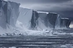 Antarctica is almost entirely covered by ice sheets up to two miles (3 km) thick, which contain roughly 70% of the world’s freshwater.
