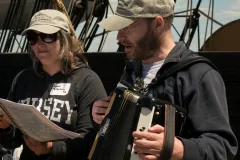 Two of the 38th Voyagers sing on board the Charles W. Morgan as it travels to ports throughout New England. 