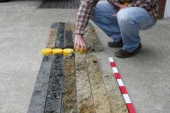 An archaeologist arranges a deep-sea core. 