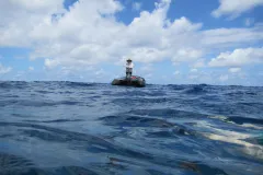A dive safety officer keeps a close eye on divers from the surface. 