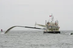 A dredge from the U.S. Army Corps of Engineers can be seen removing a sandbar off of Virginia Beach, VA. 