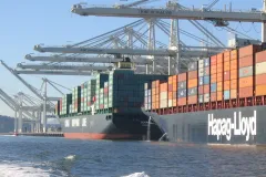 Large container ships at port, discharging ballast water in the Port of Oakland