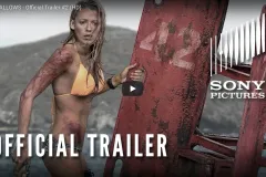 Woman in bikini clinging to buoy to avoid monster shark attack.