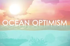 Thumb of Ocean Optimism with greenish water and pinkish sky with clouds.