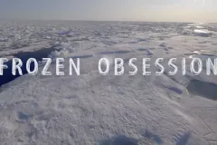 The title "Frozen Obsession" over an icy landscape background