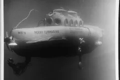 a retro submarine coasts in the ocean