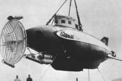 a submersible hangs from a crane