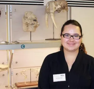 Areli next to collection items at the National Museum of Natural History. 