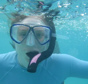 Emily Frost with snorkel gear underwater.