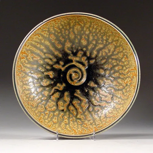 Artist Joan Lederman glazes her work with deep ocean sediments.