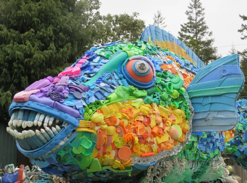 The colorful parrotfish sculpture is made entirely of ocean plastic trash.