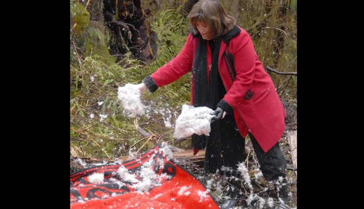 Jacqueline Peta of Sealaska’s board of directors participates in the tree-cutting ceremony.