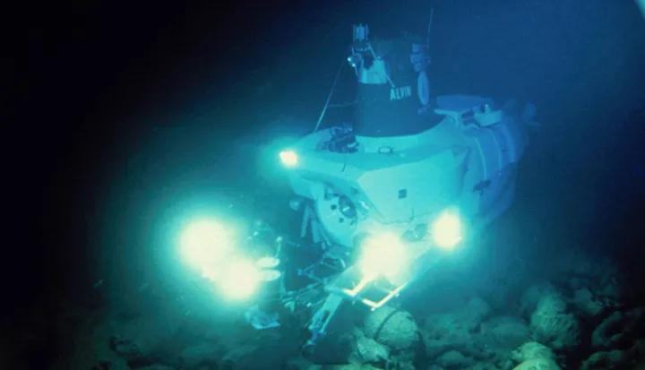 The research submersible Alvin uses bright lights to illuminate the dark seafloor.