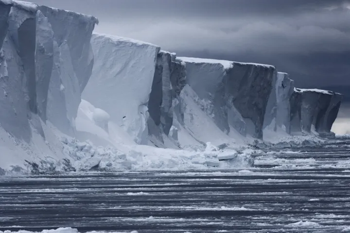 Antarctica is almost entirely covered by ice sheets up to two miles (3 km) thick, which contain roughly 70% of the world’s freshwater.