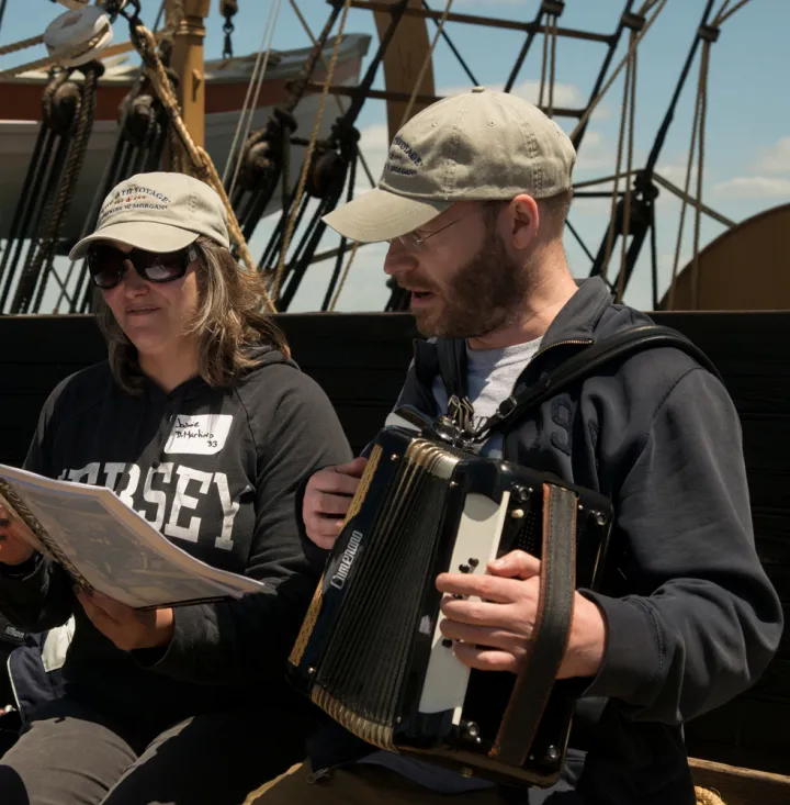 Two of the 38th Voyagers sing on board the Charles W. Morgan as it travels to ports throughout New England. 
