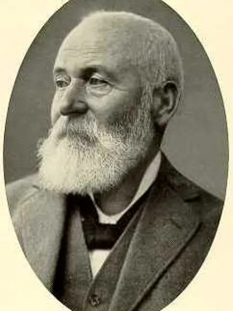 a portrait of a man with a white beard