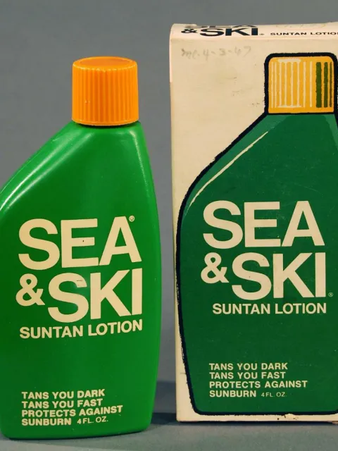 a vintage green bottle of Sea & Ski suntan lotion