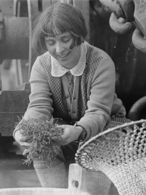 A young woman holding seaweed