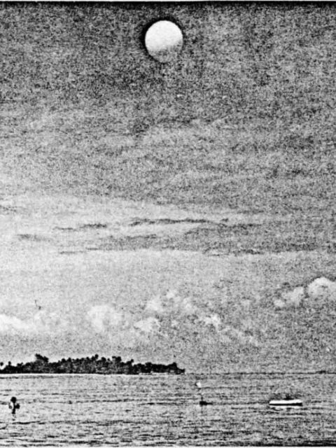 a helium balloon rises over the island.
