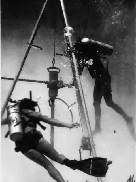 divers drill underwater